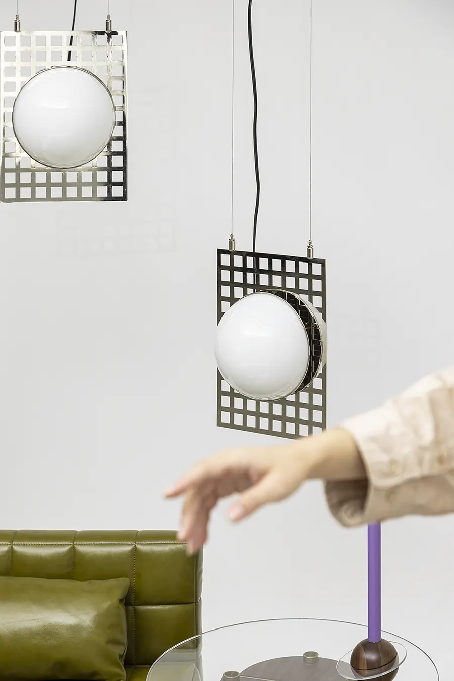 Modern Living Room Composition: Leather Sofa, Artisan Candle Holders, and Steel Pendant Table Lamp, Season 2023 Shoot For Mooza Visual Communication by SD=F